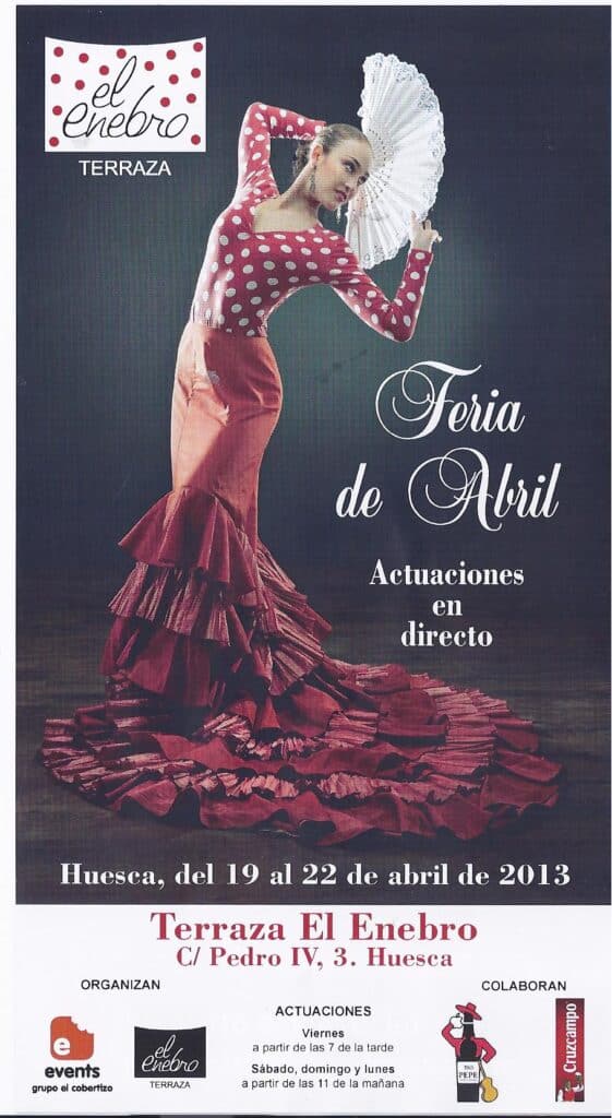 Espectáculo de flamenco en la Feria de Abril en Huesca, con actuación en vivo y vestuario tradiciona.